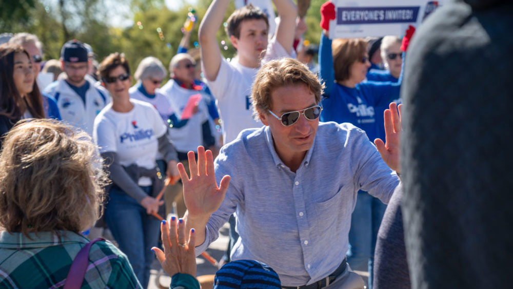 Dean Phillips marching in a parade