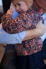 Dean Phillips hugs a little girl. Dean Phillips hugs a little girl.