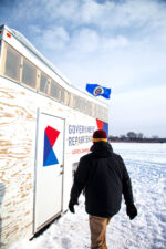 Andy Morrow walks to the Government Repair Shack on Lake Minnetonka. A Phillips supporter walks to the Government Repair Shack.