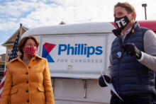 Dean speaking at a GOTV rally with Amy Klobuchar