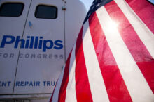 American flag and government repair truck